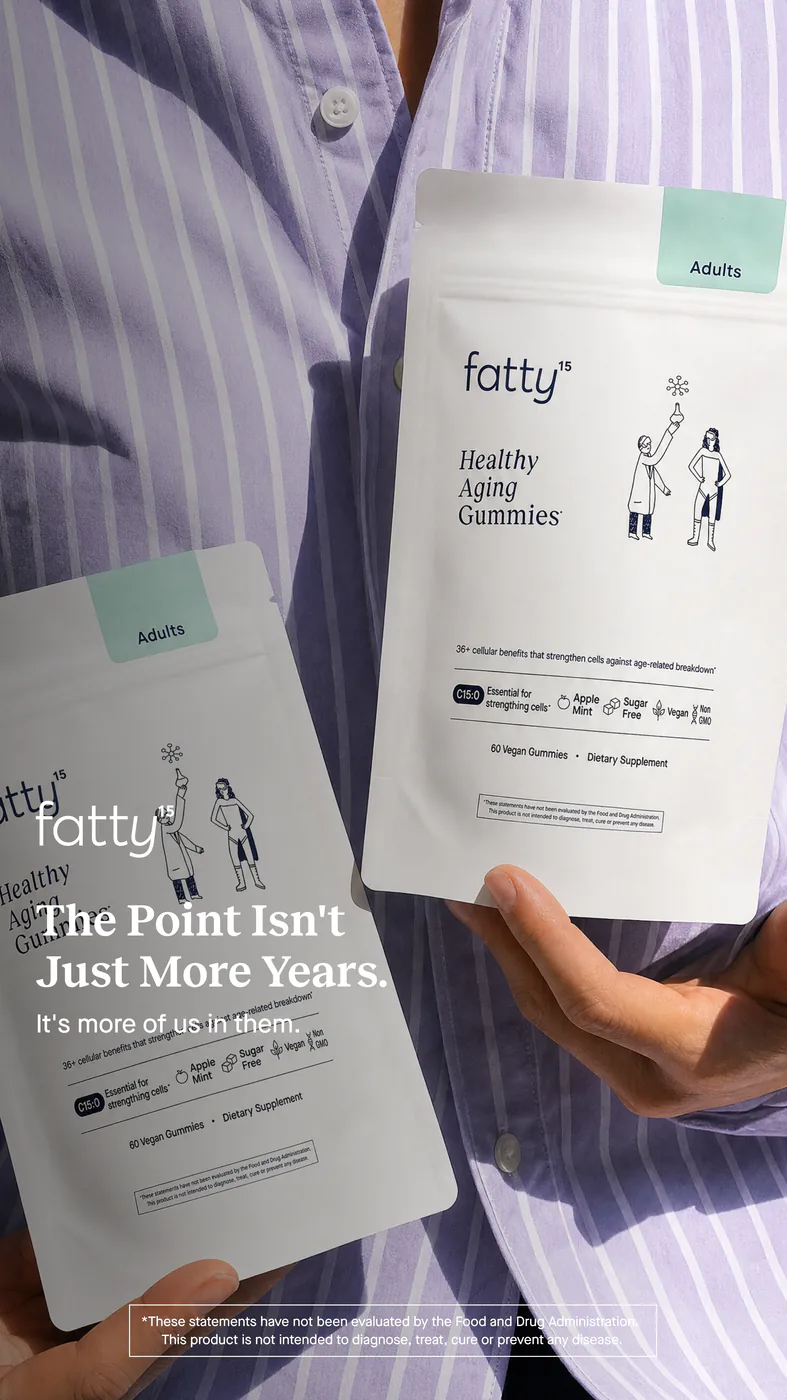Two pouches of fatty15 Healthy Aging Gummies held against a lilac striped shirt.